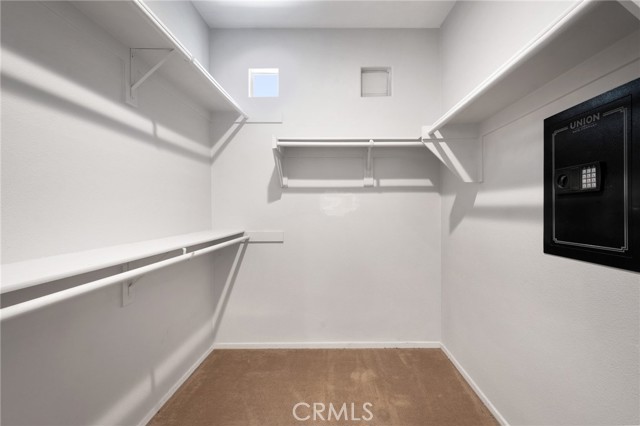 Walk-in closet with integrated wall-safe