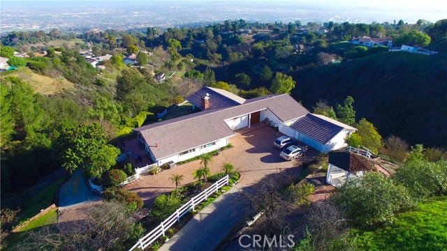 Long private driveway with plenty of space to turn around and parking for many cars in addition to the two car garage.