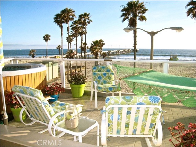 Casa Karmina is the perfect spot for your Southern CA getaway; you will stay RIGHT on the beach in the eclectic town of Venice, home to sun, surf, sail and the popular “muscle beach”!

This large unit includes 3 ½ bedrooms and 3 baths, comfortably sleeping up to 10 guests and a fully equipped kitchen—you can dine on your covered balcony/lanai or on the lower patio, right next to the sand.

We keep your hot tub at a constant 103 degrees which is the optimal temperature for maximum relaxation, and combined with the most amazing views in Venice Beach you'll create perfect serenity and have deep healing sleep.

Come in from the beach and use our hot/cold outdoor shower. We have lots of beach toys, 4 bikes, skim boards, a few boogie boards, surf boards, and rollerblades. In the winter months ride our sled/saucers down the nearby sand dunes (a favorite for the kids of all ages!) You may even want to spend a night out on the covered lanai (so you can tell everyone you slept on the beach, under the stars)--there are NO mosquitoes here! All linens, as well as beach towels and blankets are provided.

Venice has numerous fun and easy activities just outside your garden gate. Just a short distance to central Venice, Muscle Beach, entertaining street vendors, artisans and performers, or take the short ride to Santa Monica Pier and its ferris wheel/arcades. And be sure to enjoy historic Venice Pier: make it your morning or evening fun and even teach your kids to fish just a short block from the house. You can also enjoy the Historic Venice Walk Streets and the Venice Canals (Venice was originally modeled after Venice, Italy) or move along the beach to the colorful 'Venice wall’ and the skate park or south to the Marina jetty and watch the boats come and go. And finally, enjoy the fine dining at the Pier House or Mercedes, your choice of three nearby Mexican restaurants, or simply Starbucks or the local coffee house/deli, 'The Cow's End', all just literally around the corner.

Perfect for short or extended vacations, or even that corporate professional needing the most relaxed place to stay after a long days work!

Contact owner for more information or to check availability for short term or long term stays and corresponding rates; rates will vary according to time of year and length of stay.