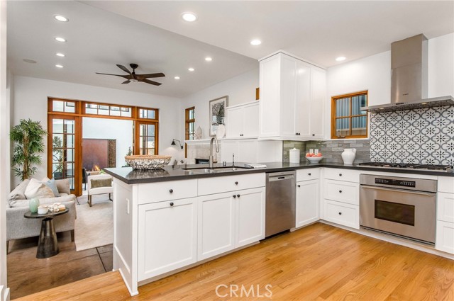 Open flow into living room with counter seating.