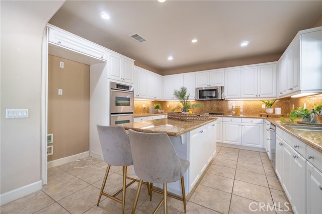 Kitchen and island with eating area