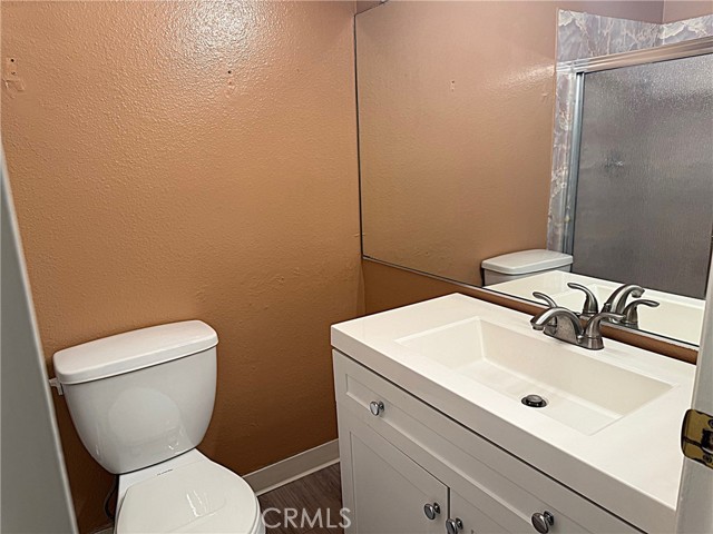 Primary bath with newer vanity and sink.