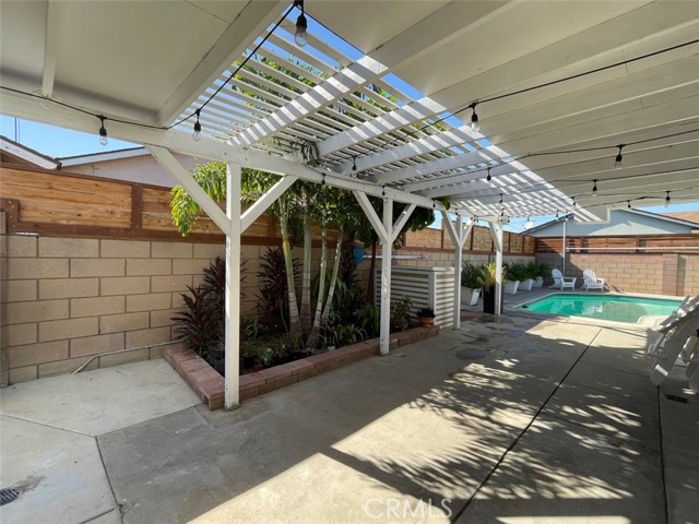 Side yard, entertainment area next to pool