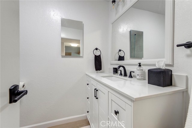 Brand new vanity and mirror in this bathroom.