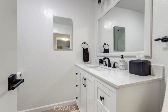 Brand new vanity and mirror in this bathroom.