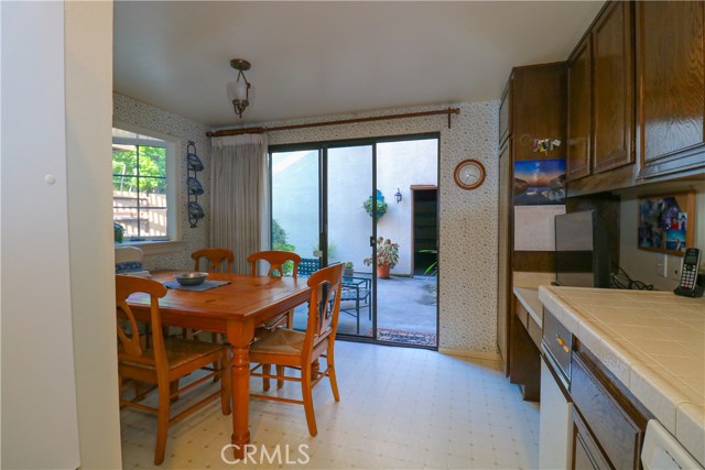 Dining area in kitchen. Sliding glass doors exterior sitting area and garage.