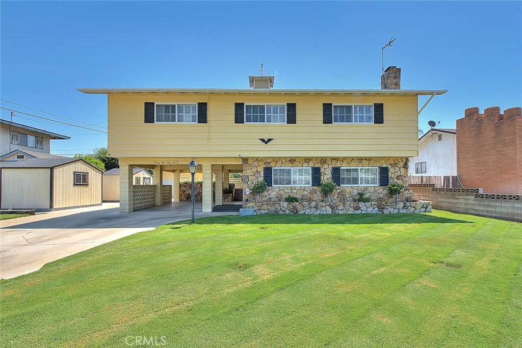 Come see this beautiful tri level home located in a high demand east side neighborhood of Fontana. This home offers four bedrooms and two and a half bathrooms with 2162 sq. ft. of living space all situated on a large 7840 sq. ft. lot. Spacious kitchen with an attached dining area and family room on the second floor. Separate living room, half bath and indoor laundry room on ground floor. All bedrooms and two additional baths are upstairs on third level.
There is a second level outdoor patio deck, carport and detached two car garage. Beautifully manicured lawns, recent exterior paint as well as two large storage sheds. Walking distance to Palmetto Elementary School.