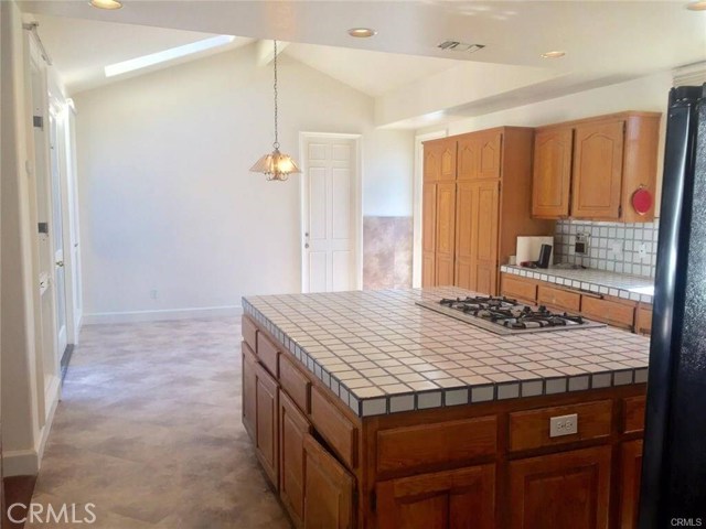 Kitchen with eating area, access to side patio and garage Kitchen with eating area, access to side patio and garage