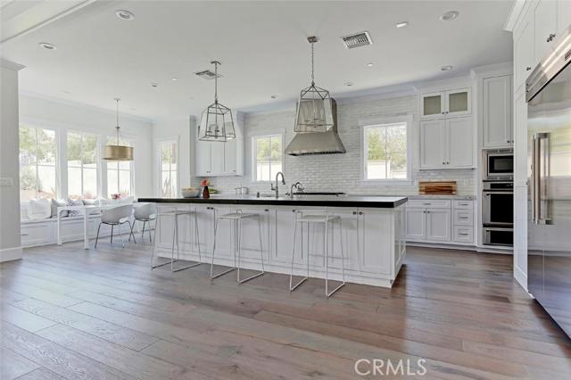 Kitchen features a breakfast bar and dining nook