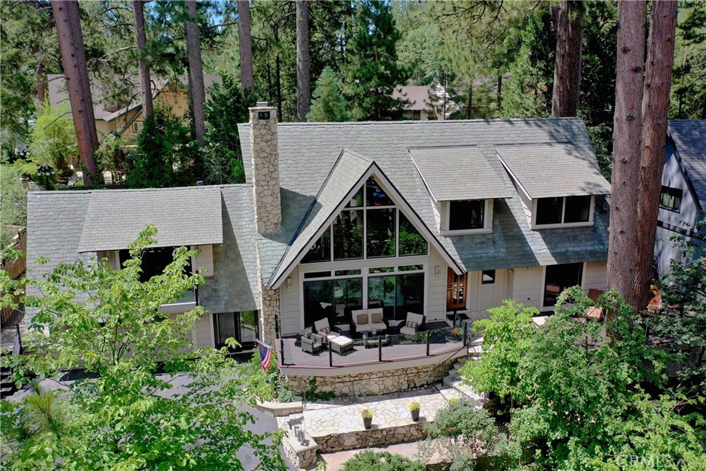 HAMILTAIR ESTATES LAKEVIEW REDUCED, the only guard gated community with private beaches, launch ramp, 24 hour security, and even a private tennis-pickle ball court for members. This rare architecturally designed home has been updated to reflect a Less is More attitude which enhances the beautiful indoor/outdoor living lifestyle. Water views from almost every room mingle with picturesque tall pines and dog wood trees meandering to rear yard with the illusion of seclusion. Tons of decking front and back, a potting shed, spa, and a lovely potential meditation area will surely put the pause in you. The floor plan is absolutely fabulous with vaulted ceilings, walls of glass, and specialty custom floors and fixtures. An easy to prep and cook kitchen with stainless appliances is adjacent to bar area with ice maker and wine fridge. 4 potential bedrooms with a primary suite on main level, and 2 en-suite guest rooms on upper level offer ultimate comfortable sleeping quarters for all with an additional bonus/family room also a flexible amenity for family media viewing, game playing, or one big slumber party. Additional Office Space, is also a potential bunkroom!  The attached garage has electric charge station, a golf cart, and easy access to another sought after feature, your own private dock slip at marina 4!  This home is coming turnkey as you see it, furnished per inventory!  If you are motivated to bring your toothbrush and not your paint brush, This is it! Lakeside living in Hamiltair is hugely sought after and especially friendly and safe. Offering annual fishing tournaments, BBQ, and even ponies and camels have made holiday memories for all.  Please call for details and showings-List agent is also a Hamiltair property owner.