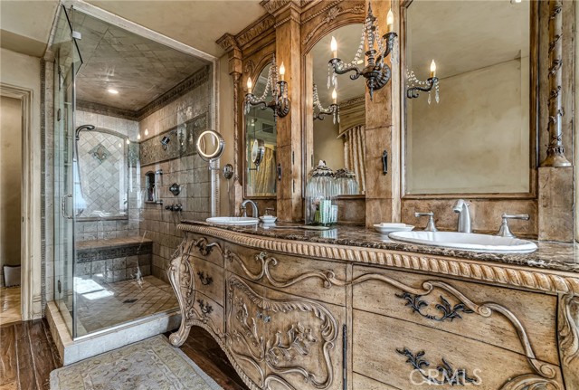 Dual sinks in master bathroom along with steam shower.