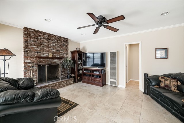 family room with bricked fireplace