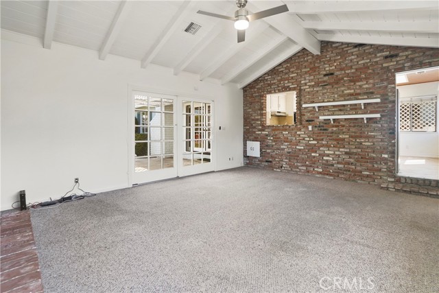 Great room with views into kitchen and sliders to back yard
