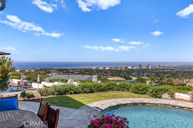 Located in the prestigious, 24 hour guard gated community of Harbor Ridge, this custom estate arguably boasts some of the best views in Newport Beach.  Meticulously maintained over the past 25 years, this dream home offers move-in ready plush amenities throughout and a careful balance of warmth, charm, and coastal cool. Enter the grounds through a private gated courtyard and enjoy the meticulous landscaping. 5 Bedrooms, 5.5 bathrooms, an executive office, chef’s kitchen, pantry, laundry room, elevator, 3-car garage, pool, and spa provide considerable comfort for any discerning buyer seeking out the solace of SoCal living. A spacious primary master suite with dual bathrooms & closets and second master suite with generous walk-in closet complete this custom estate. Enjoy expansive views of the Pacific coast, Catalina Island, city lights, and surrounding foothills from Orange County to LA. Centrally located within Newport Beach, you will enjoy this prime location with easy access to world-class shopping and dining, pristine beaches, boating harbors, the airport, and freeways.