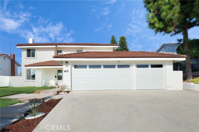 Amazing opportunity to live in one of Fullerton’s most prestigious neighborhoods! Completely remodeled with the trendiest touches. This home has one of the best curb appeal in the neighborhood. Fresh whisper-white exterior paint with new grass with modern accent plants.  Spacious 3-CAR GARAGE that’ll store everything you need and want. The Interior has brand-new premium laminate flooring throughout the entire home with recessed lighting. Brand new windows and sliders along with matching whisper-white interior paint. Formal living room and family room that opens up into the dining room with a fully remodeled kitchen with new cabinets, premium quartz countertops, stainless steel appliances, and a custom kitchen island! There is an additional nook that can be used as an office or lounge area. Separate laundry room downstairs that leads into the large 3-car garage. Three bedrooms along with the master bedroom suite are all upstairs. All bathrooms have been tastefully modernized.
The cozy backyard and a side yard with fruit trees for you to enjoy throughout the year.  Top Fullerton school district and close to all the entertainment amenities that Fullerton has to offer! Welcome home to 1401 Carleton Way!