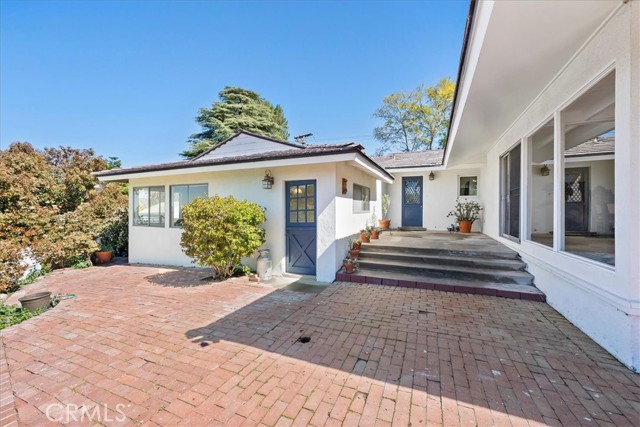 Upper Patio with access to bonus storage room & garage