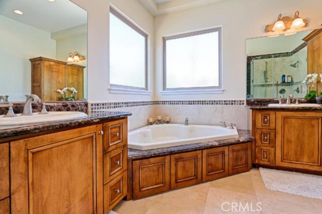 Master bathroom - just spectacular - travertine floors- double vanity\'s with granite countertops and lovely 10 jet tub. Your own personal spa day awaits. Master bathroom - just spectacular - travertine floors- double vanity\'s with granite countertops and lovely 10 jet tub. Your own personal spa day awaits.