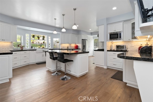 Stunning And Expansive Kitchen With Island