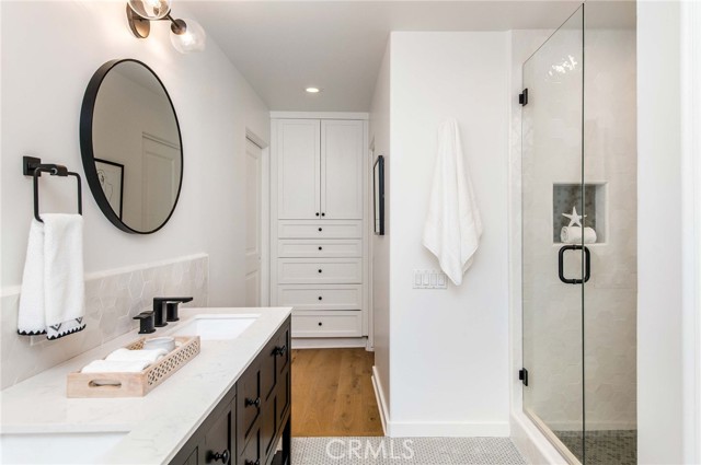 Primary bathroom with built-in storage and walk-in master closet.