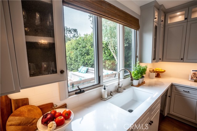 Kitchen Sink beneath picture window.