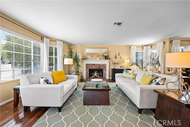Living room with Fireplace and custom window treatments