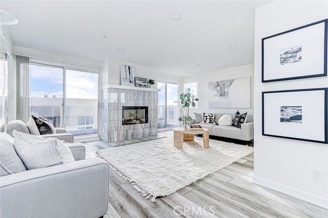 Second level family room with it's own fireplace and viewing deck.