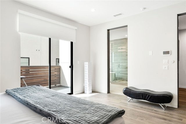 Spacious primary suite with balcony