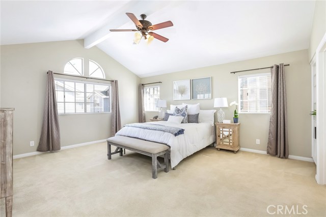 Master with vaulted ceiling and fan