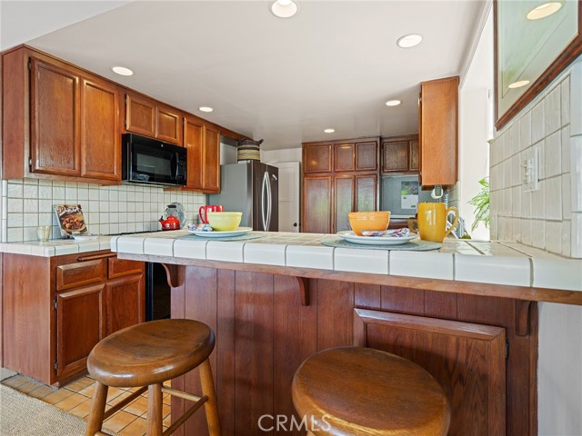 Kitchen with bar area and plenty of storage Kitchen with bar area and plenty of storage