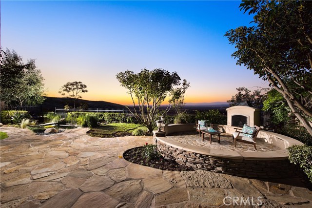 29 Fresco Irvine, California PANORAMIC CITY LIGHTS VIEWS to enjoy every day from beautiful "Vicara Plan 4" estate home in Quail Hill - one of Irvine's most prestigious, friendly, and ideally-located communities. Many upgrades throughout the 5 bedroom, 5 baths estate home - including the largest model among Quail Hill's subdivisions. Guests will be awed by the grand staircase in the entry. A master hallway leads to adjoining Formal Living Room and Formal Dining Room. The chef-inspired kitchen with stainless steel appliances, granite counter tops, and upgraded cabinets connects to a spacious family room and breakfast nook with large windows for a spectacular view! Two separate staircases connect downstairs and upstairs living. Spacious downstairs bedroom with a full bath. A spacious master bedroom complimented by an attached retreat and balcony, with 3 spacious bedrooms upstairs. Professionally landscaped backyard with Koi Pond and outdoor Fire Place with stone circular seating- perfect for nights outside as you enjoy the view. Attached 3 car garage with driveway and street parking. Quail Hill includes 3 Community Pools, 5 Parks, walking distance to Alderwood Elementary, Community Fitness Center, Tennis Courts, Basketball Courts, and Beautiful Trails connected to our community for hiking and mountain bike riding. Located in the award-winning University High School / Irvine Unified School District. Only 7 miles to Laguna Beach, and minutes from world-class shopping and the John Wayne International Airport.