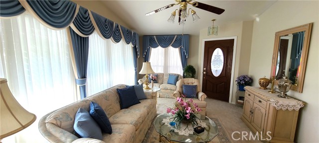 Formal Living Room with plenty of natural lighting and a beautiful view.