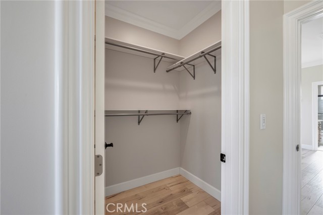 Primary bedroom walk in closet.