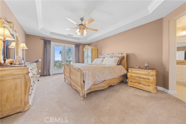 Bedroom #2: Primary Suite with French doors that lead to the beautiful deck!
