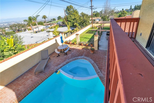 View of the pool and city from balcony