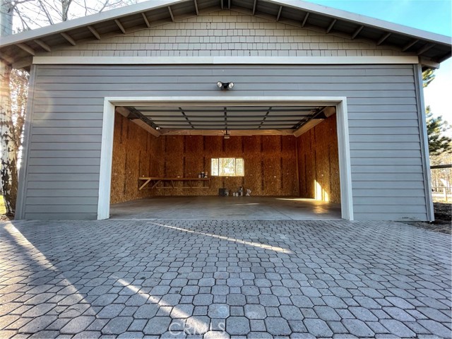 700 square foot garage with tall door and ceiling