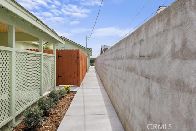 Concrete Walkway giving access from Whitcomb to the Alley