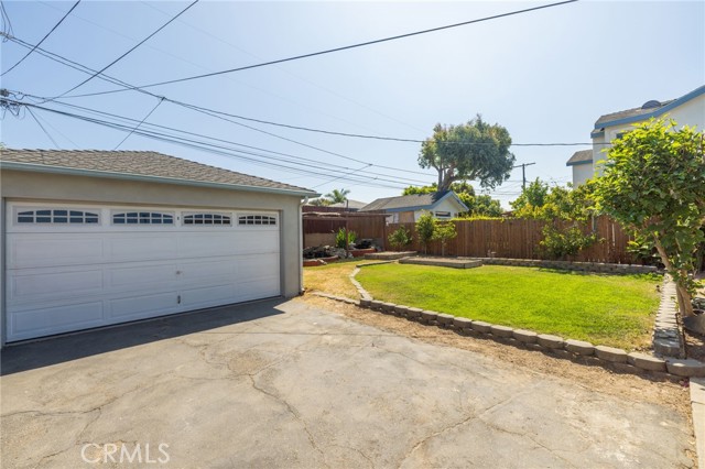 Your private, spacious yard. 2 car garage. Lots of fruit trees. Koi pond and koi. Lit patio for entertaining and evening meals.