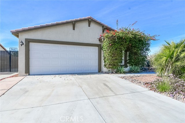 Beautiful 3 bedroom, 1.75 bathroom, single story home with a sparkling swimming pool in the gated community of Shadow Hills in Indio! Enjoy an open floor plan, tile flooring, and ceiling fans. The kitchen offers tile countertops, a walk-in pantry, and a center island with a breakfast bar that opens to the family room. The primary bedroom features carpet flooring, dual sinks in the primary bathroom, and a walk-in shower. Sliding doors lead to the covered outdoor patio, the swimming pool, and back yard. Additional property highlights include a laundry room, a 2 car garage, and RV parking. Community amenities include picnic area and a playground. Convenient to local schools, parks, shopping, and freeways!