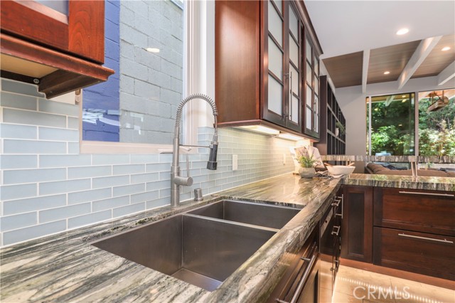 The seaglass brick back splash is beautiful....