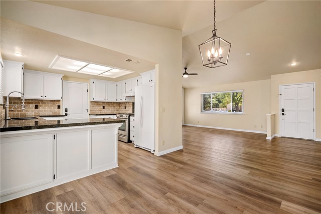 The dining area is perfectly situated between the kitchen and living room.