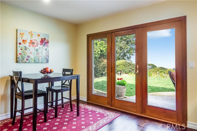 Breakfast area leads yard, patio and sweeping views.