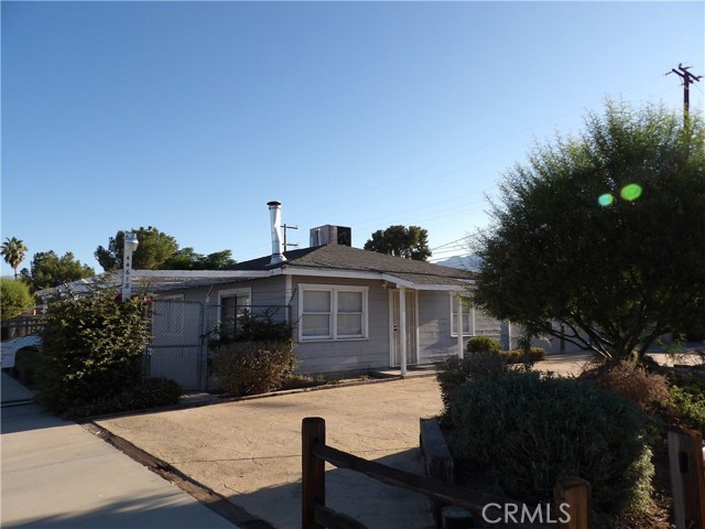 Two homes and a detached garage on a commercial lot. Also Additional 30 space RV storage spots -CUP . Front home is a 3 bedroom, 1 bath aprox , Detached 2 car garage , then a 1 bedroom, 1 bath home , 2 electric meters , Gas , city water . Loads of options here . Motivated seller. Almost 1 acre along Hwy 74 , fully fenced . Very low tax aprox 1.1%