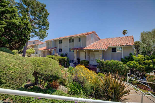 Amazing opportunity to own this spacious townhome in the Malibu Villas. This 2 bedroom 3 bathroom plus loft condo offers lots of space, high ceilings, and peekaboo ocean views. The upstairs loft has a full bathroom and can easily be used as a third bedroom. Features include hardwood floors throughout, walk-in closet in the master bedroom, balcony off the master bedroom, cosy patio off the 2nd bedroom, wood burning fireplace in the living room and two car garage. Washer and dryer located in the garage. The community offers a pool, hottub, spa, and clubhouse. This townhome could be turned into your dream home!