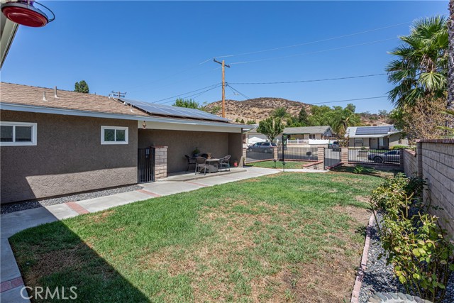 28209 Hot Springs - Fully fenced font yard with covered patio area and hillside views!