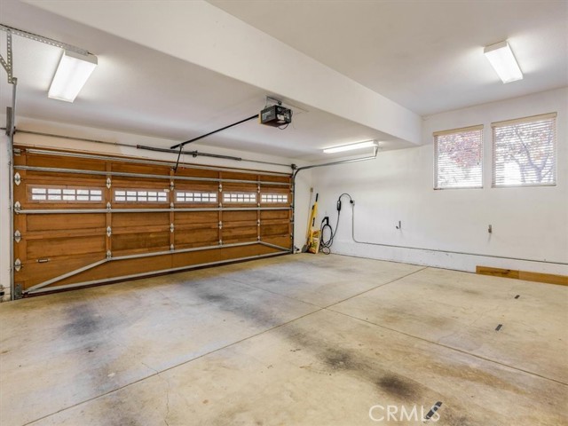 The garage has a high speed EV plug in for an electric car.