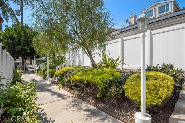 Nicely-landscaped grounds. Unit is set back from Vanderbilt & Artesia for minimal noise