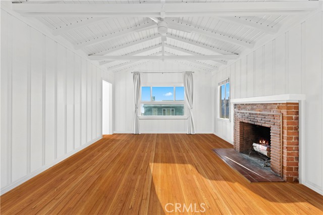 Light filled living room w/wood beamed ceilings