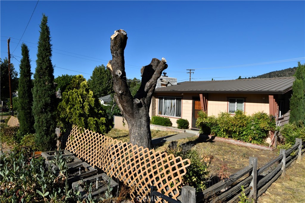 New carpet in the living room, new vinyl flooring and new front door! Ready to move in Home in the outskirts of Yreka, near YMCA and walk distance from downtown. This well-maintained home features 3 spacious bedrooms one being a primary with a tile shower enclosed. Living room, kitchen and dining room interconnect and are very ample. The outside area is ready with raised beds for all your vegetables, it has matured grape vines and apple trees. The garage for one car has some storage room, the RV covered park space is a must see. Call today to schedule an appointment to see this home. Sellers also consider a rent to own with an option to buy.