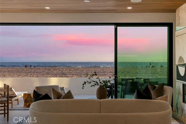 5007 Seashore Drive Newport Beach, California Modern Masterpiece on the Sand — Newport Beach’s Crown Jewel. Introducing 5007 Seashore Drive — a striking, newly completed oceanfront estate that redefines luxury coastal living. Perfectly positioned on the sand in one of Newport Beach’s most desirable stretches of shoreline, this architectural gem offers an unrivaled beachfront lifestyle with panoramic ocean vistas from every level. Step inside and experience cutting-edge design, open-concept living, and walls of glass that erase the line between indoors and out. From the sleek, contemporary finishes to the curated floor plan crafted for effortless flow, every detail has been considered to capture the essence of seaside sophistication. A true entertainer’s dream, the expansive rooftop deck—spanning over 750 sq. ft.—delivers unobstructed sunset views and the perfect backdrop for oceanfront dining, lounging, or stargazing under the Pacific sky. Brand-new construction, ultra-rare location, and direct beach access — this is a once-in-a-generation opportunity to own a front-row seat to the ocean in Newport Beach. Enjoy World class Shopping and Dining with Nobu Newport beach and the Balboa bay resorts just minutes away.