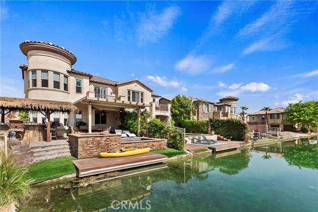 43258 Bacino Court Indio, California HURRY and Grab the only current Terra Lago Lido Lake Front Property on the Market! Serene Waterfront location with boat dock, and New Custom Stone Private Pool & Spa, Palapa covered bbq Ready for any Celebration! Truly like living a Dream. 3 Spacious Bedrooms, office nook, plus this Castle comes complete with Turret. Elegant step-down circular bar, Gourmet kitchen, formal dining room and so much more. Property is also situated in a Private Gate Guarded Community and one of the fewer communities that allow Short Term Rentals, the lake front Rentals are known for their year round high income.